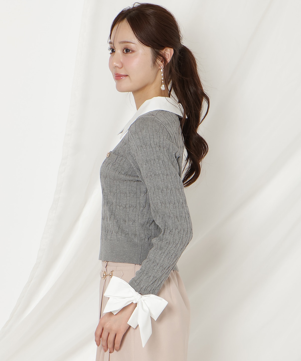 リボンカフスドッキングケーブルニット