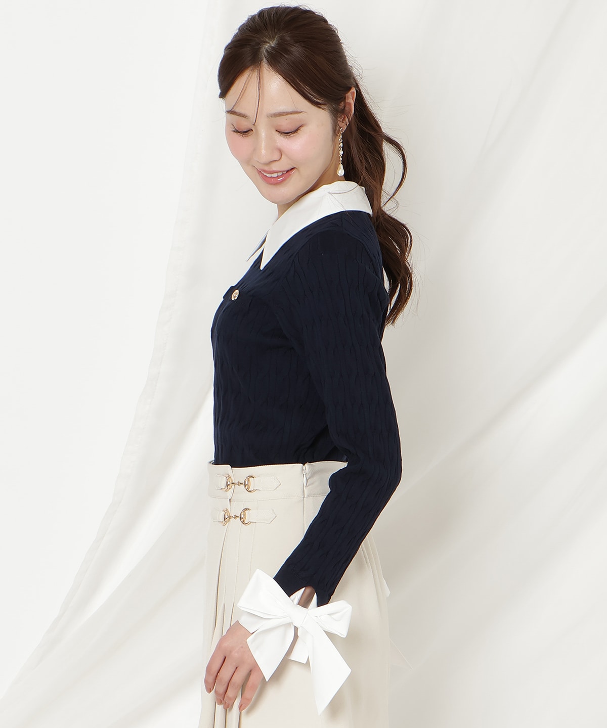 リボンカフスドッキングケーブルニット