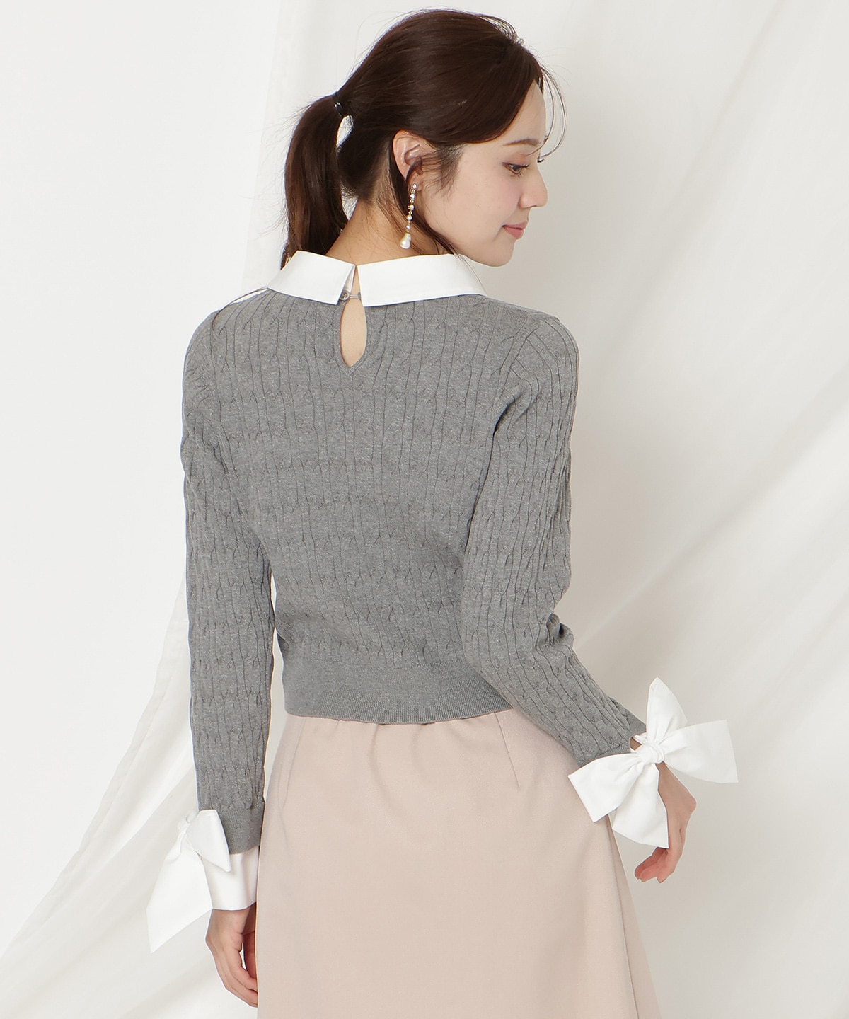 リボンカフスドッキングケーブルニット