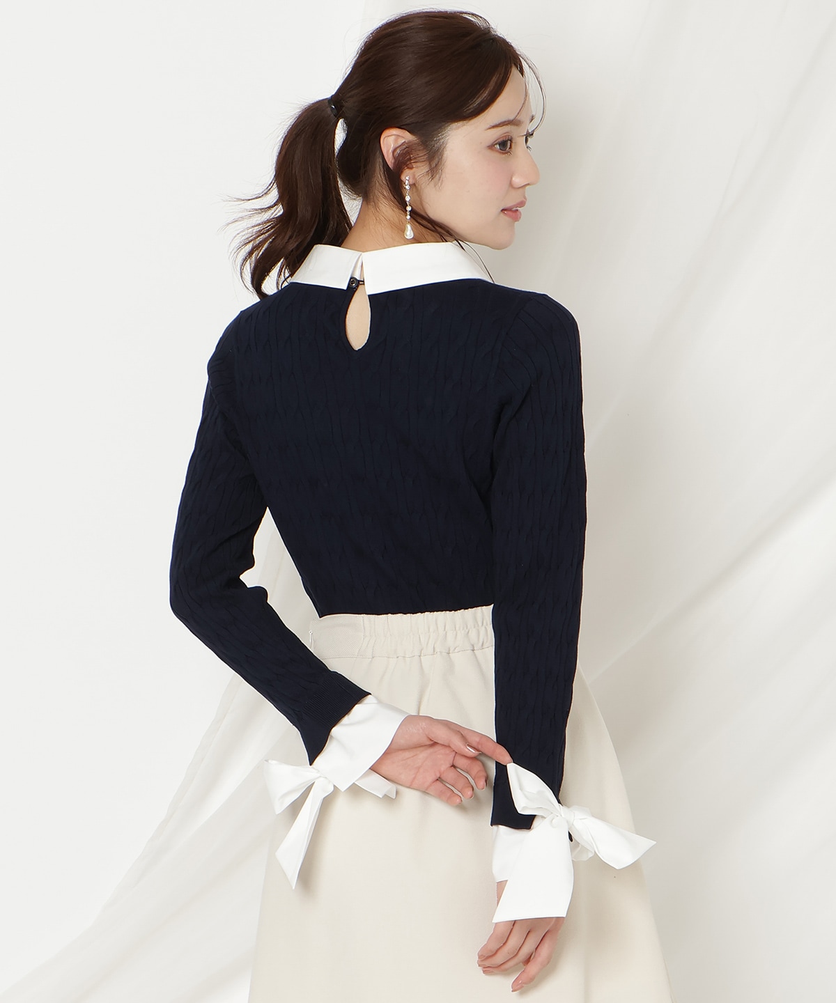 リボンカフスドッキングケーブルニット