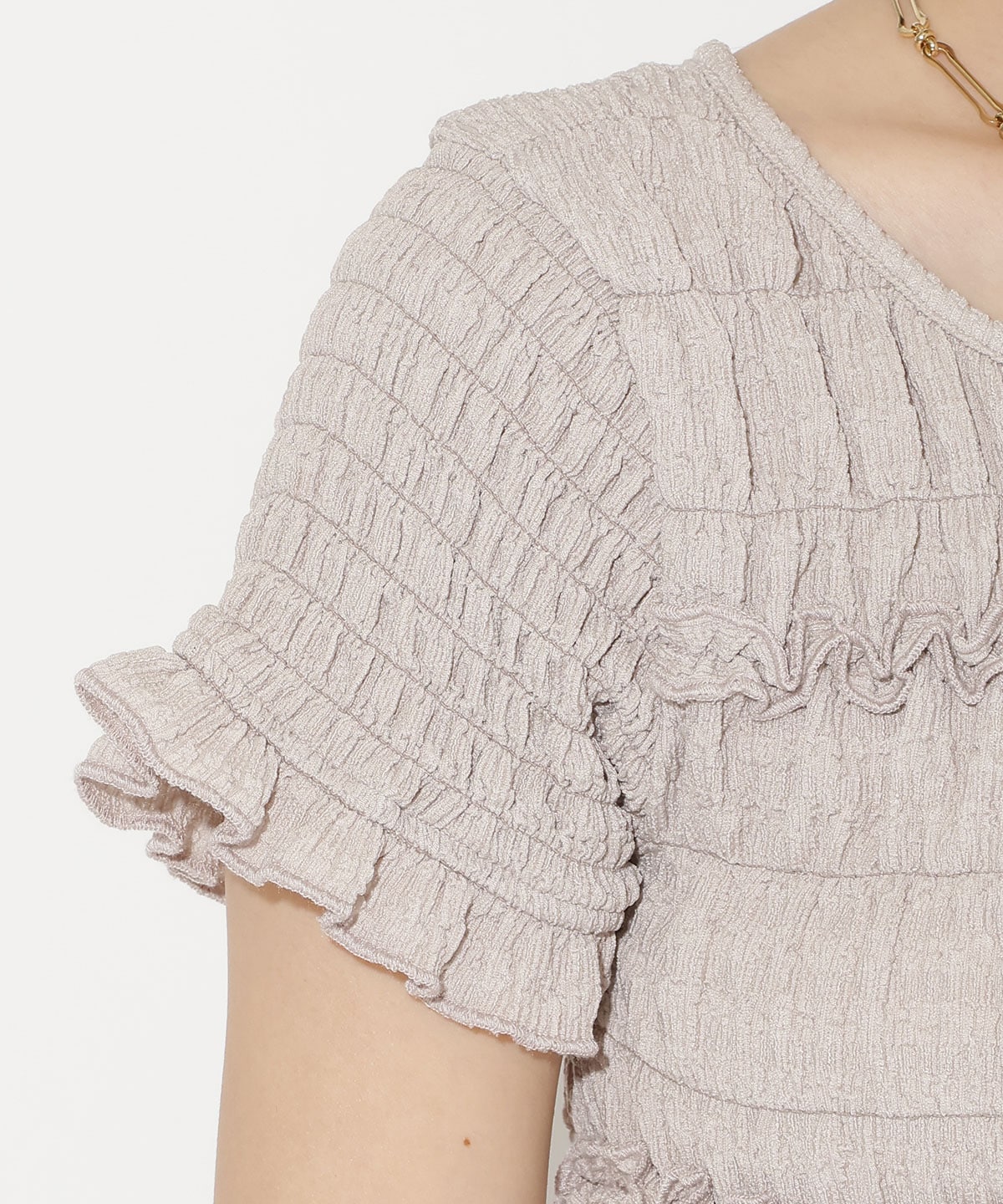 シャーリングフリルトップス