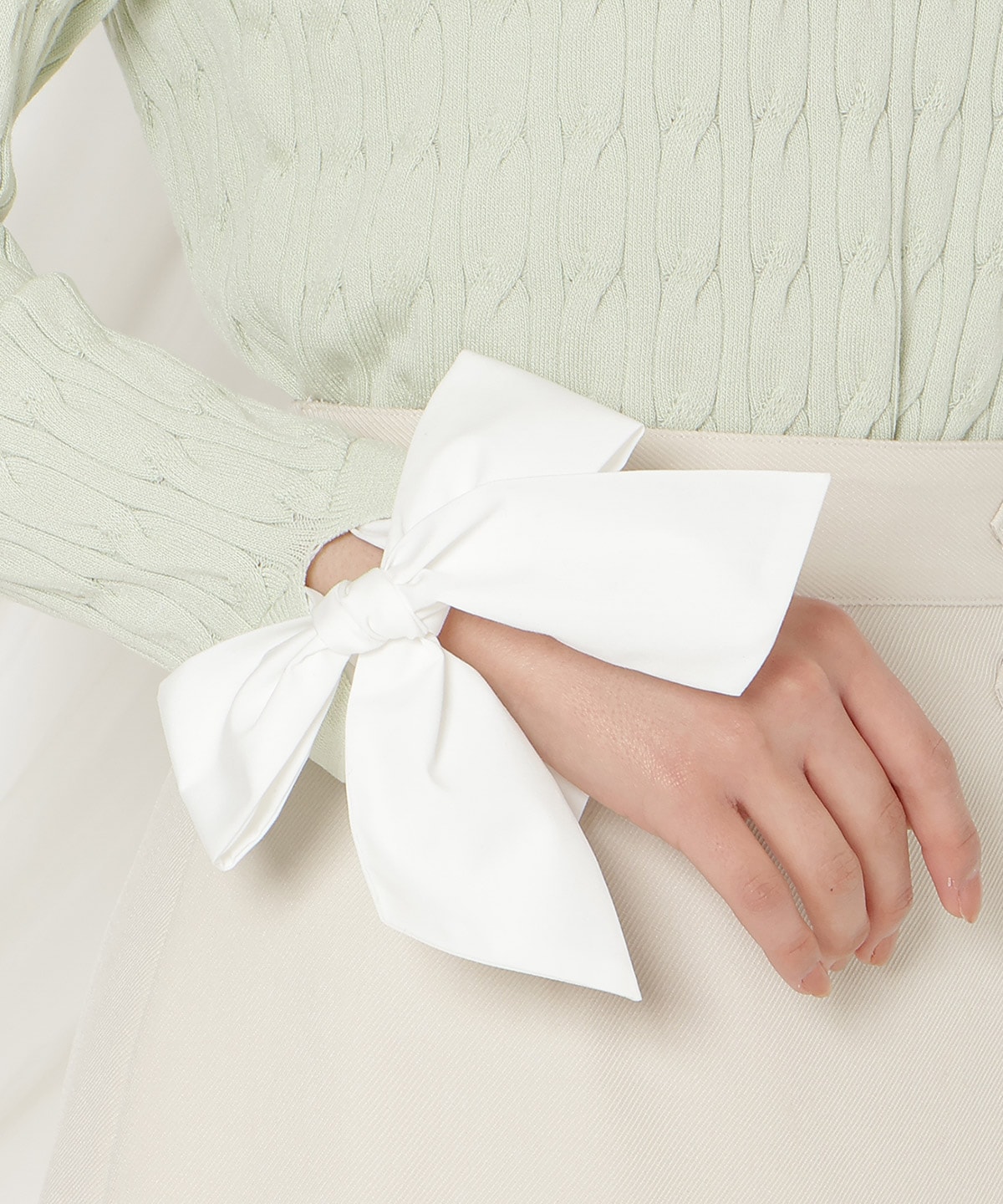 リボンカフスドッキングケーブルニット