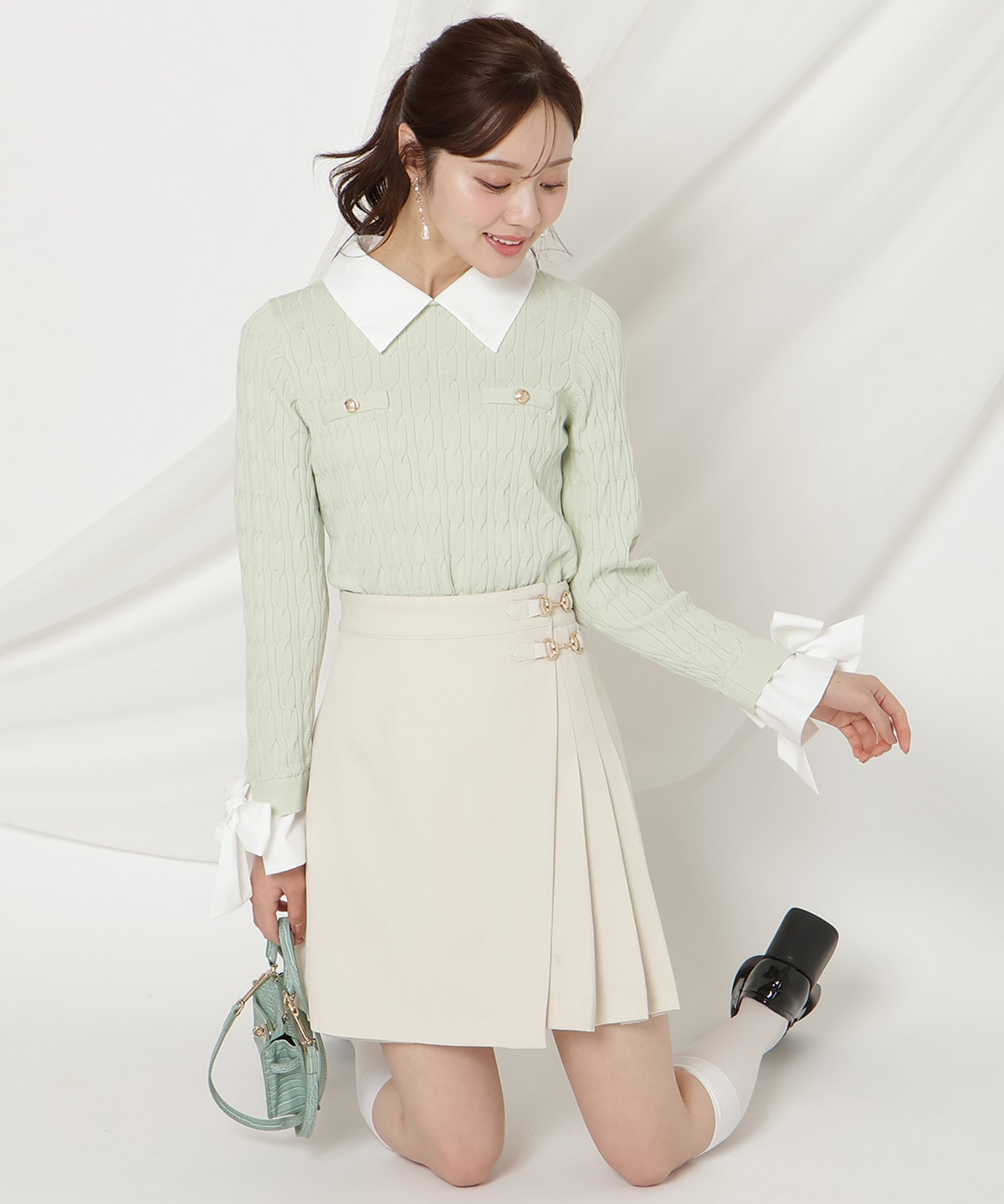 リボンカフスドッキングケーブルニット