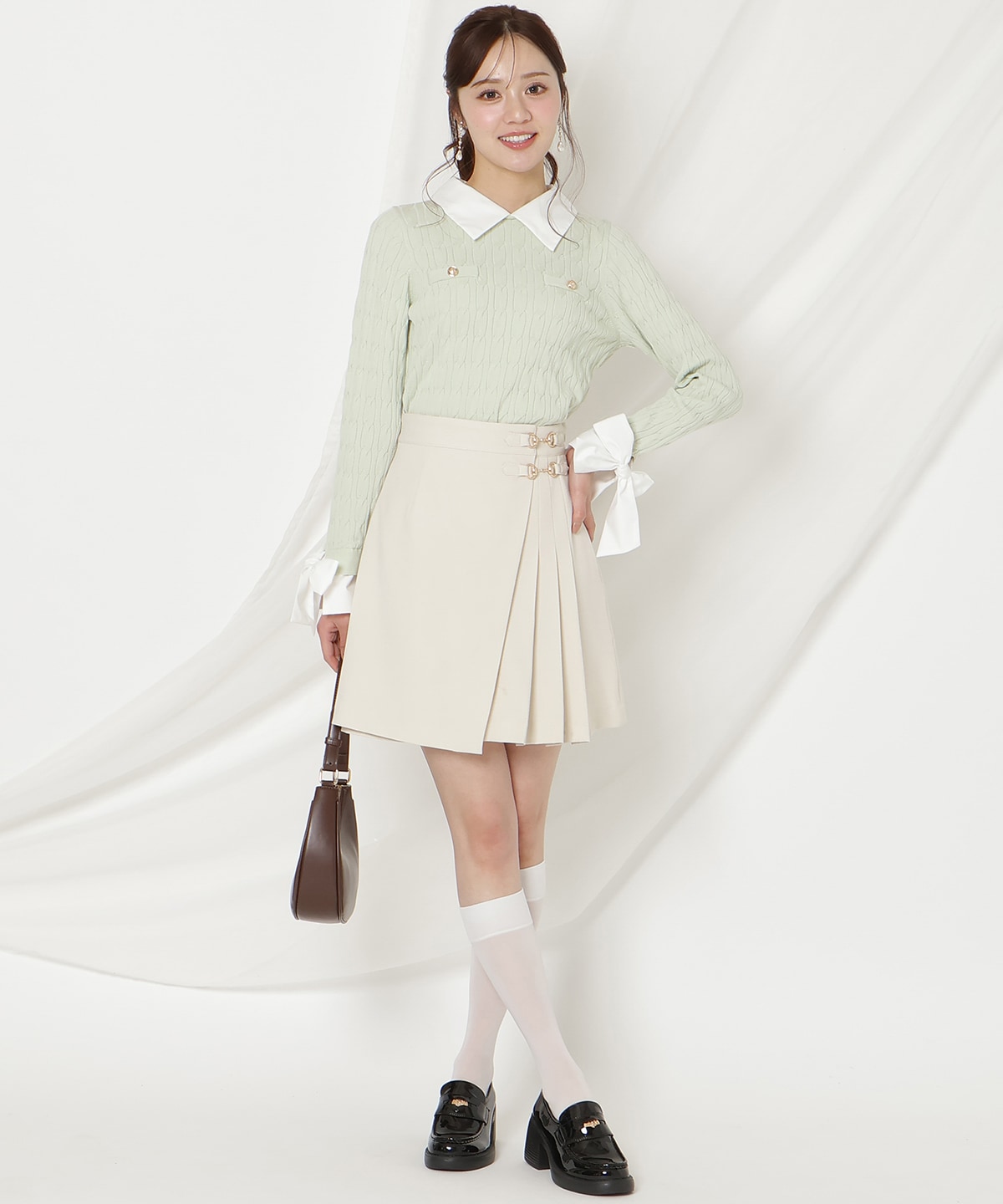 リボンカフスドッキングケーブルニット