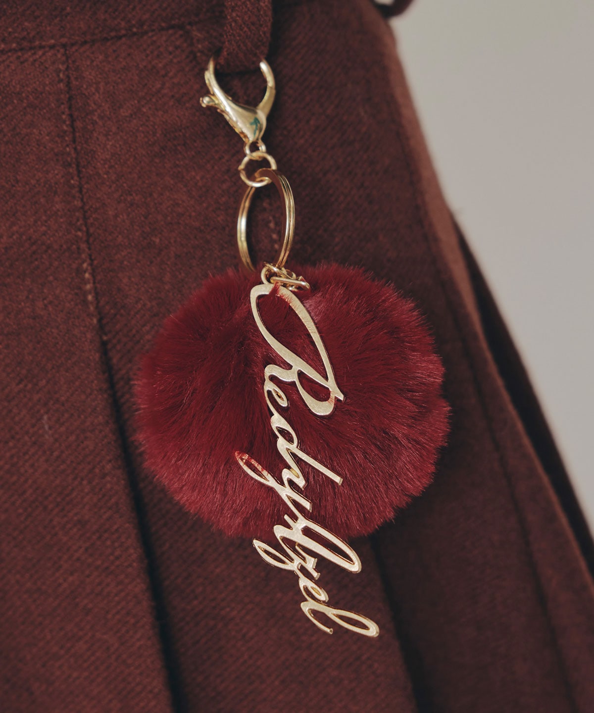 ファーチャームウールライクプリーツミニスカート