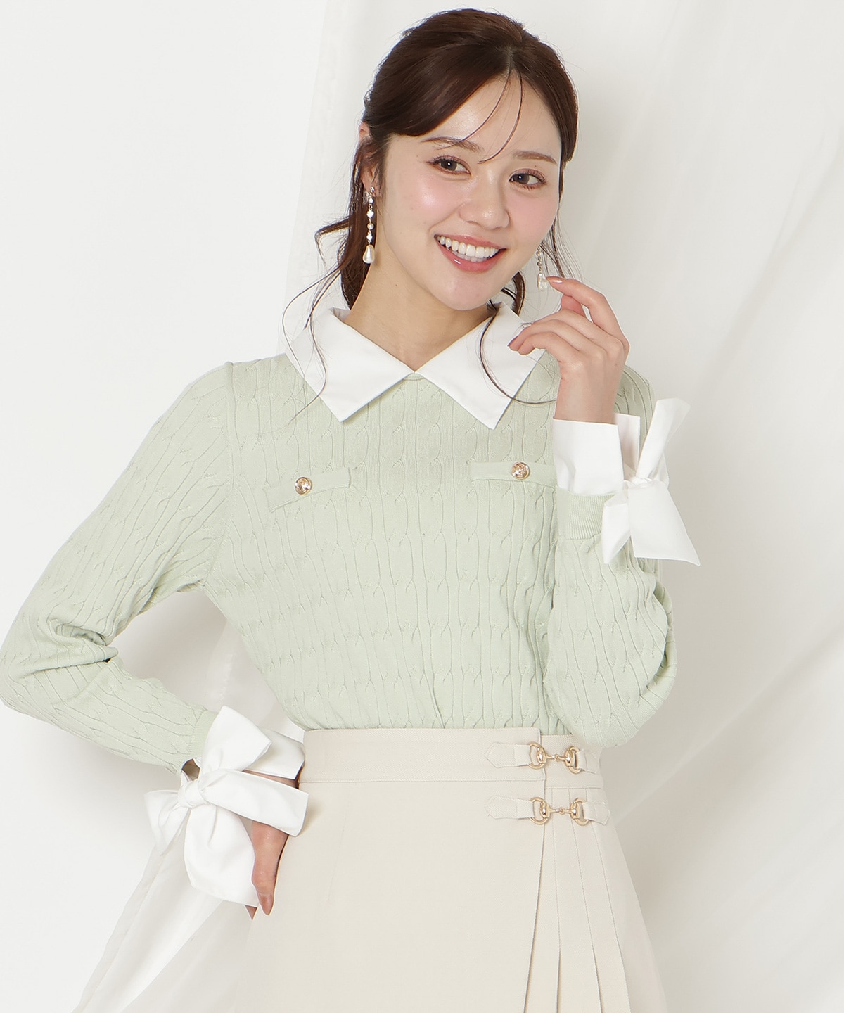 リボンカフスドッキングケーブルニット